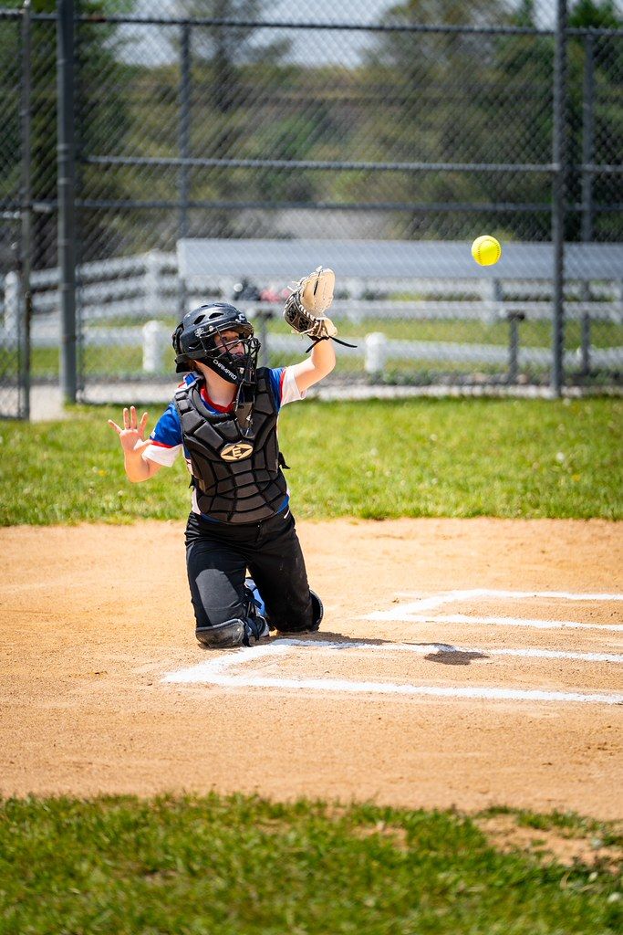 Catcher reaching for the ball